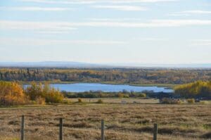 Lake in distance with field in foreground for Mighty Peace Watershed Alliance