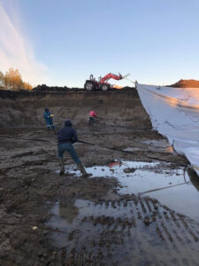 Family working on the dugout at DNA Gardens in Alberta.